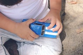 child with a toy car in his hands