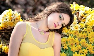portrait of a woman on the daffodils background
