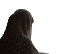 man in black blanket on a white background