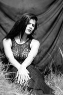 serious brunette in black and white