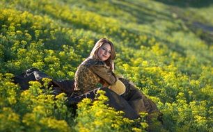 young woman in princess dress on the yellow meadow