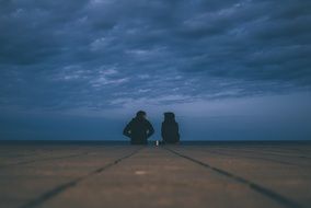 silhouettes of a young couple at dusk