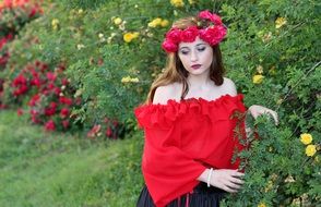 young woman on the rose bushes background