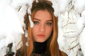 girl photographed in a pile of snow