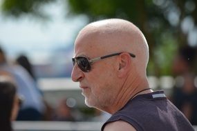 bald man in sunglasses