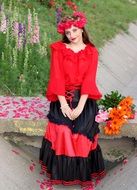 model in red blouse with floral wreath