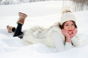 Girl lying on a snow