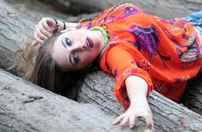 model posing in the orange blouse