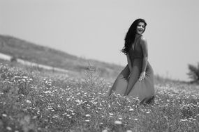 happy brunette on the summer meadow