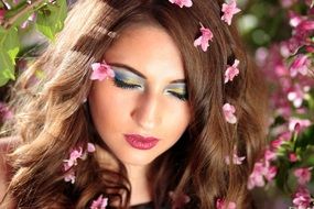 model with pink flowers in hair