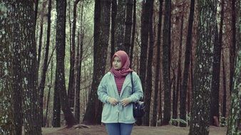 muslim Girl stays in forest