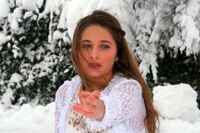 sensual girl posing among the winter landscape