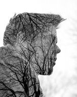 profile portrait with silhouettes of trees