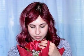 Portrait of beautiful brunette girl and tulips flowers