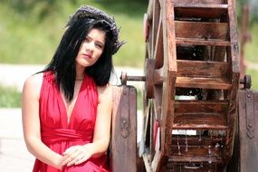 model with floral wreath by the mill