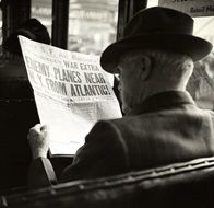 monochrome picture of 1930 of man with newspaper