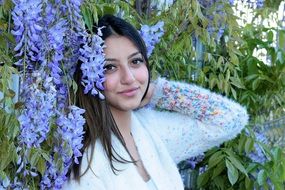 beautiful woman on the purple flowers background