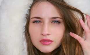 portrait of a sensual girl in a fur coat