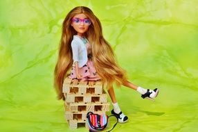 doll with glasses on pallets