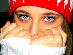 girl with blue eyes in a red hat