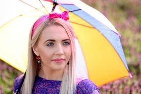 beautiful blonde woman with colorful umbrella