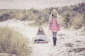 sisters walk in the snow