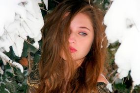 portrait of a sensual girl among the snow