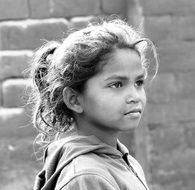 profile portrait of a little girl in black and white
