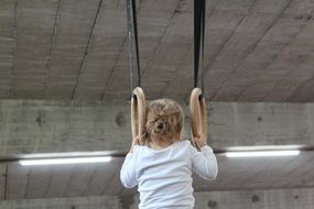 Small child with the gymnastic equipment