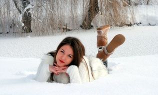 young woman posing on the snow