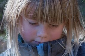 portrait of a thoughtful little girl