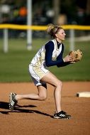 girl is playing softball