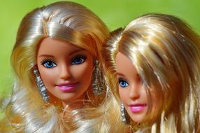 two Barbie dolls with white hair