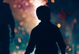 silhouette of a child in the dark