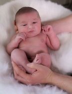 newborn in hands closeup