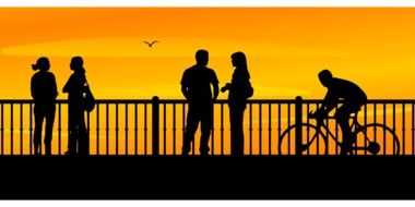 silhouettes of people on the promenade