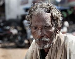 Beggar on Street, old dark skin man portrait, India