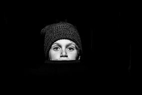 black and white portrait of a boy in a hat