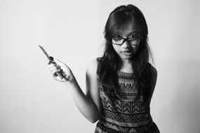 black-white portrait of a girl with a knife