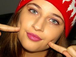 portrait of a beautiful blonde in a red hat