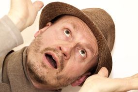 caucasian Man in Hat Looking up