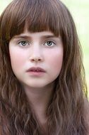 portrait of a girl with curly brown hair