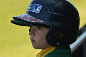 a child in a baseball helmet