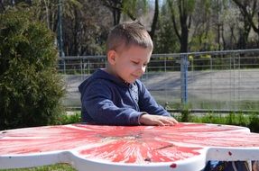 little boy in the park on a sunny day