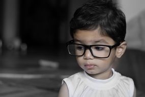 little girl in glasses
