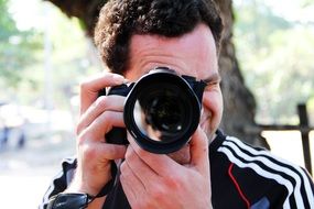 photographer with camera on a sunny day