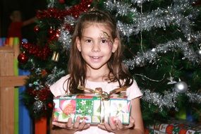 little girl near the christmas tree