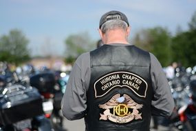 Biker in a jacket View from the back