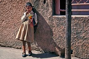 indian girl near the building on a sunny day