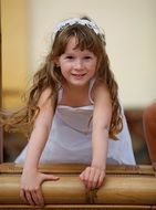 little girl in a white dress at a wedding